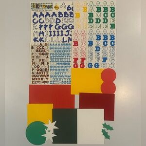 Scrapbooking alphabet stickers and die cut decorative shapes